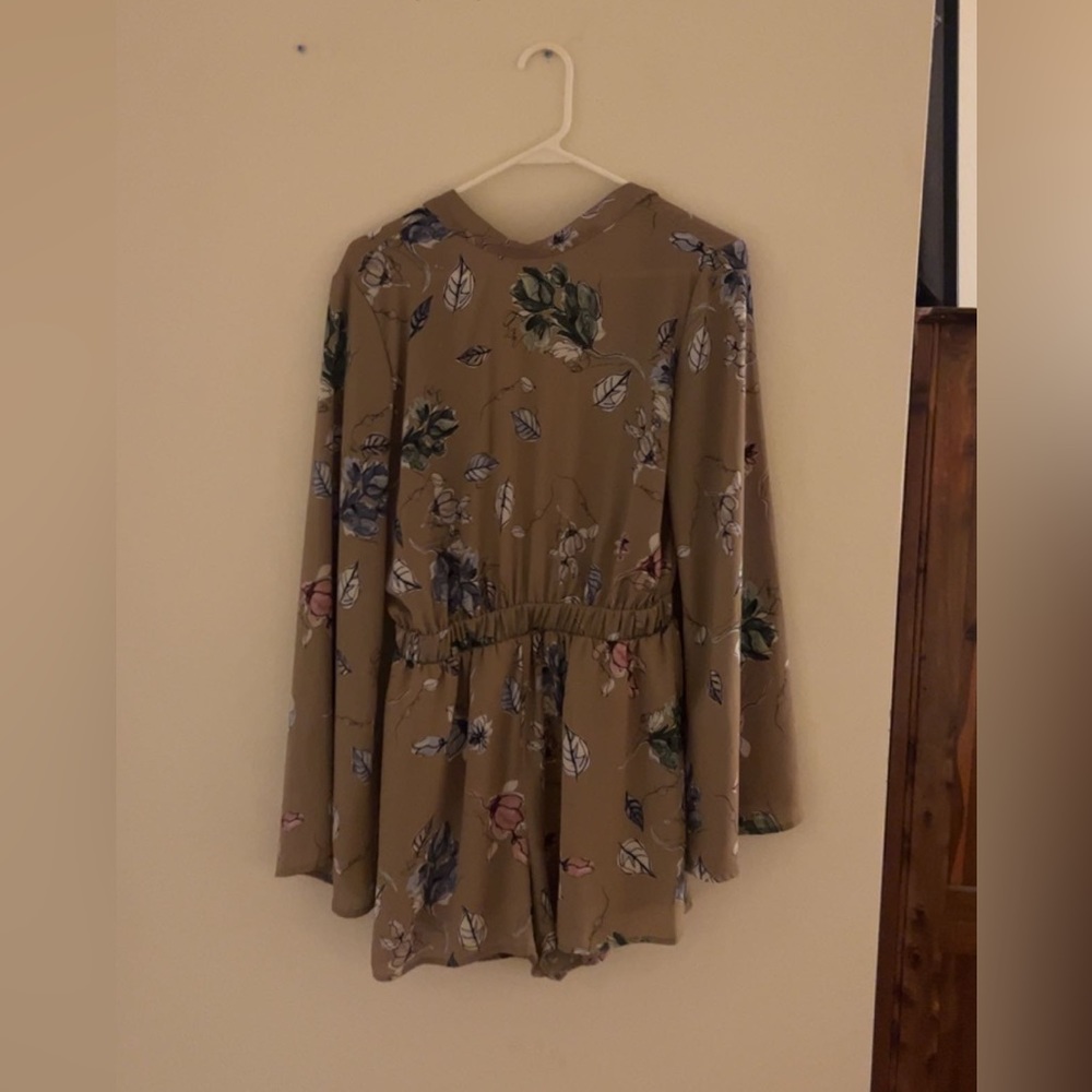 Tan floral romper. Beautiful backless romper perfect for date night!